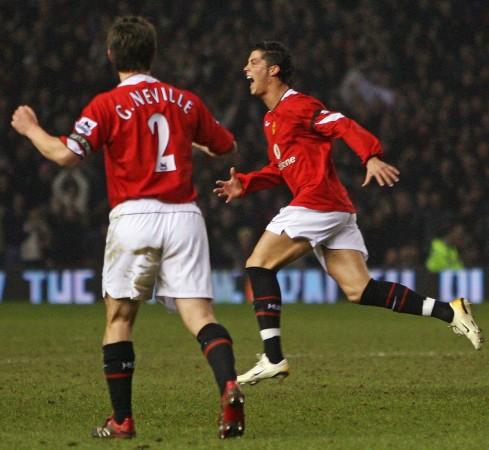 Manchester United's Cristiano Ronaldo (R) celebrates his goal against Fulham as Gary Neville looks on during a Premier League match at Old Trafford in February 2006. Gary neville