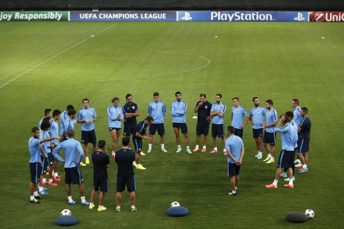 Atletico Madrid players attend a training session on the eve of their Champions League match against Olympiakos at the Karaiskaki stadium in Piraeus near Athens Atletico Madrid players attend a training session on the eve of their Champions League match against Olympiakos at the Karaiskaki stadium in Piraeus near Athens