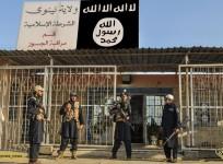 Islamic State Army police outside its newly setup police station in Mosul