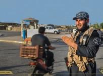 An ISIS army police mans a traffic junction in Mosul