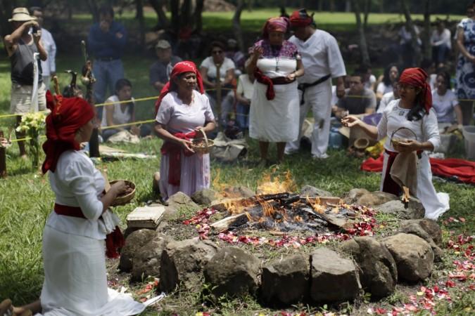 Members of the Mayan priest council pray in celebration of Autumn equinox