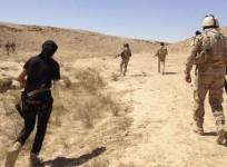 Iraqi security forces are pictured during a patrol looking for militants of the Islamic State of Iraq and Syria (ISIS) on the outskirts of Haditha, in Iraq, on September 9, 2014.
