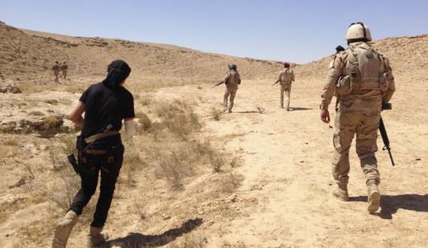 Iraqi security forces are pictured during a patrol looking for militants of the Islamic State of Iraq and Syria (ISIS) on the outskirts of Haditha, in Iraq, on September 9, 2014.