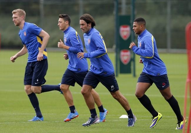 Robert Pires has been training with the Arsenal squad to keep himself fit Robert Pires Arsenal Mertesacker Ozil Gnabry