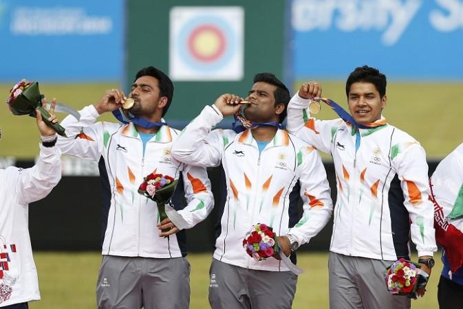 Sandeep Kumar, Rajat Chauhan and Abhishek Verma are a picture of delight after clinching the gold medal in the men's compound team archery Sandeep Kumar Rajat Chauhan Abhishek Verma Asian Games