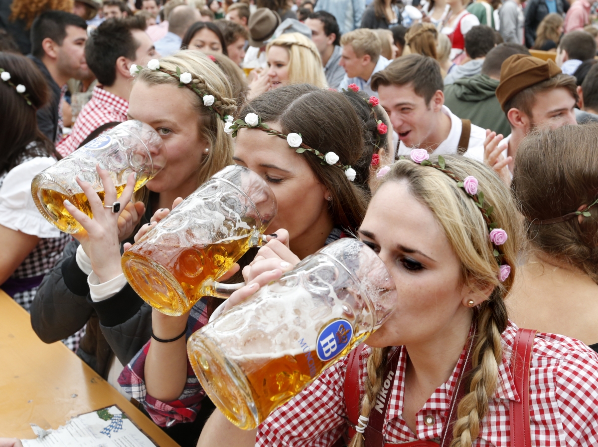 Visitors enjoy beer during their visit to the 181st Oktoberfest in Munich o...