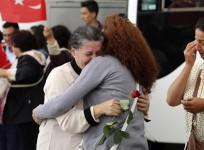 An employee at Turkey's consulate in Mosul is welcomed by her relatives at Esenboga airport in Ankara.