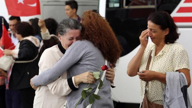 An employee at Turkey's consulate in Mosul is welcomed by her relatives at Esenboga airport in Ankara.