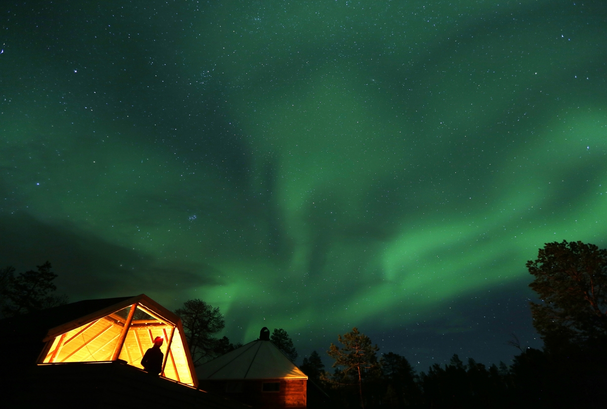 The Aurora Borealis (Northern Lights) is seen over a mountain camp north of the Arctic Circle, near the village of Mestervik early 2 October, 2014. Aurora Borealis (Northern Lights) seen over a mountain camp north of the Arctic Circle