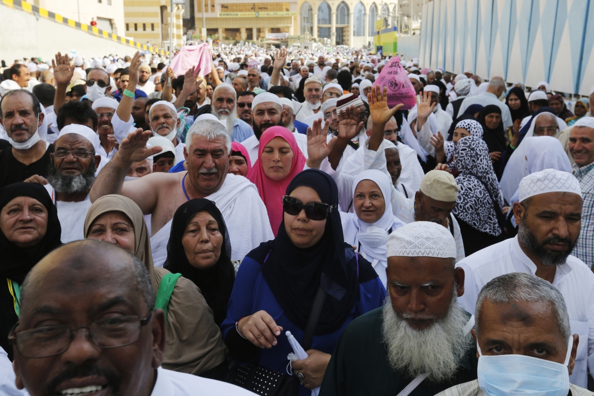 Muslim pilgrims walk towards the Grand Mosque during the annual Hajj pilgrimage in Mecca