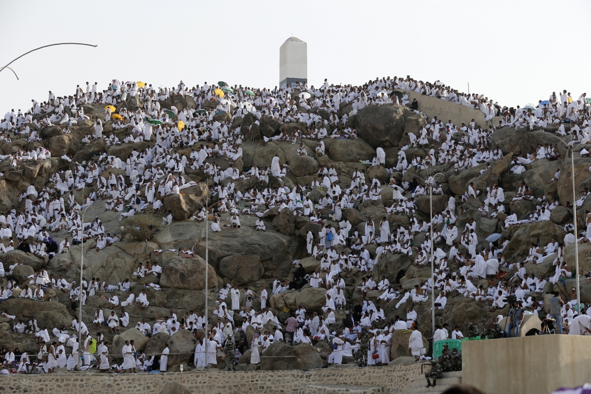 Muslim pilgrims pray on Mount Mercy on the plains of Arafat during the annual haj pilgrimage, outside the holy city of Mecca