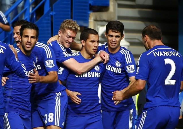 Chelsea's Eden Hazard (C) celebrates with teammates after scoring a penalty against Arsenal during their English Premier League soccer match at Stamford Bridge Eden Hazard