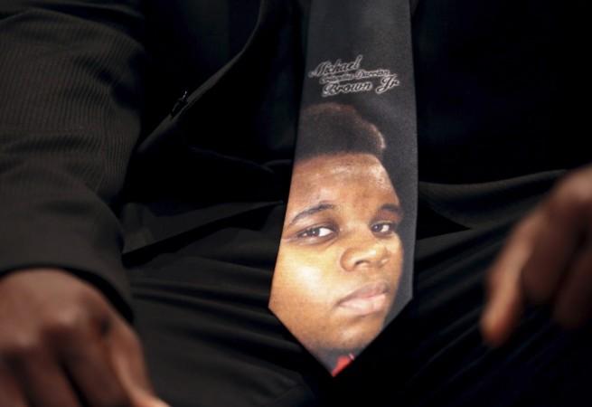 An unidentified man wears a tie decorated with a picture of Michael Brown, during funeral service at Friendly Temple Missionary Baptist Church in St. Louis, Missouri, August 25, 2014. An unidentified man wears a tie decorated with a picture of Michael Brown, during funeral service at Friendly Temple Missionary Baptist Church in St. Louis, Missouri, August 25, 2014.