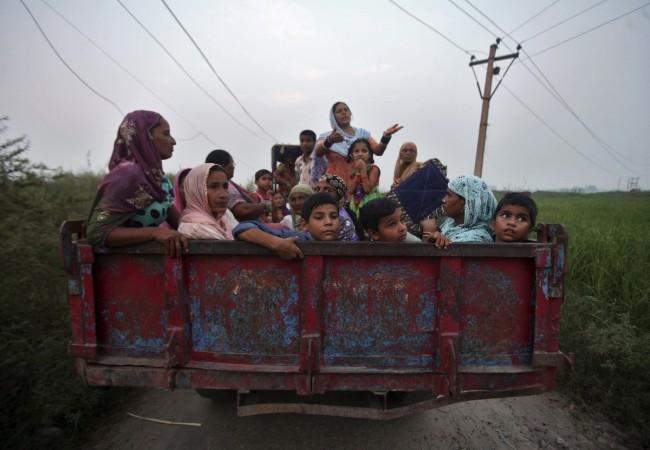 Indian villagers sit in a tractor trolley as they move to safer places at Devi Garh village near Jammu. (Representational Image) Indian villagers sit in a tractor trolley as they move to safer places at Devi Garh village near Jammu, October 7, 2014. REUTERS/Mukesh Gupta