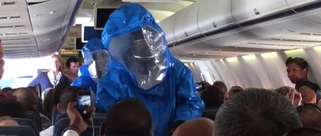 The flight was grounded until the hazmat crew isolated the passenger, who was not actually Ebola-infected. Man jokes about Ebola in US Airways flight