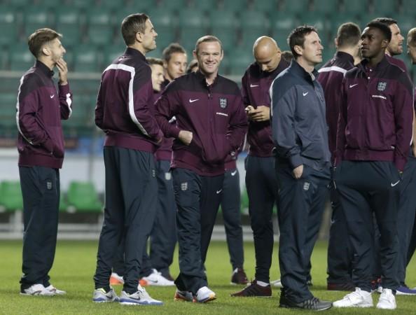 England captain Wayne Rooney (C) with teammates inspect Lillekula Stadium in Tallinn, ahead their Euro 2016 qualification match with Estonia England