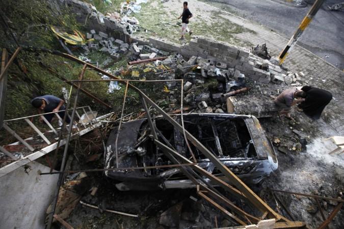ISIS militant group ambushed a military base in Western Iraqi town of Hit and seized all of its arms and ammunitions. (Photo: A destroyed car is seen at the site of Tuesday's car bomb attack, at the entrance to the neighbourhood of Kadhimiya in Baghdad, October 15, 2014. The suicide car bombing killed a parliament member and 24 others in the Shi'ite neighborhood in Baghdad) ISIS militant group ambushed a military base in Western Iraqi town of Hit and seized all of its arms and ammunitions.