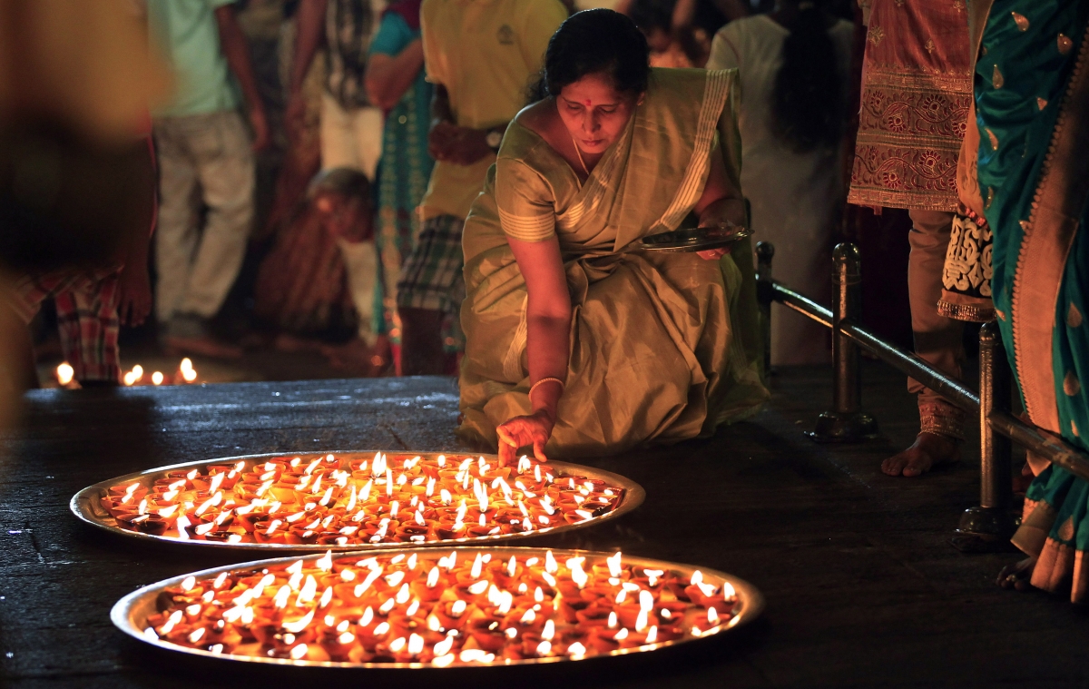 Hindu people celebrate the festival by lighting up oiled lamps Diwali 2014
