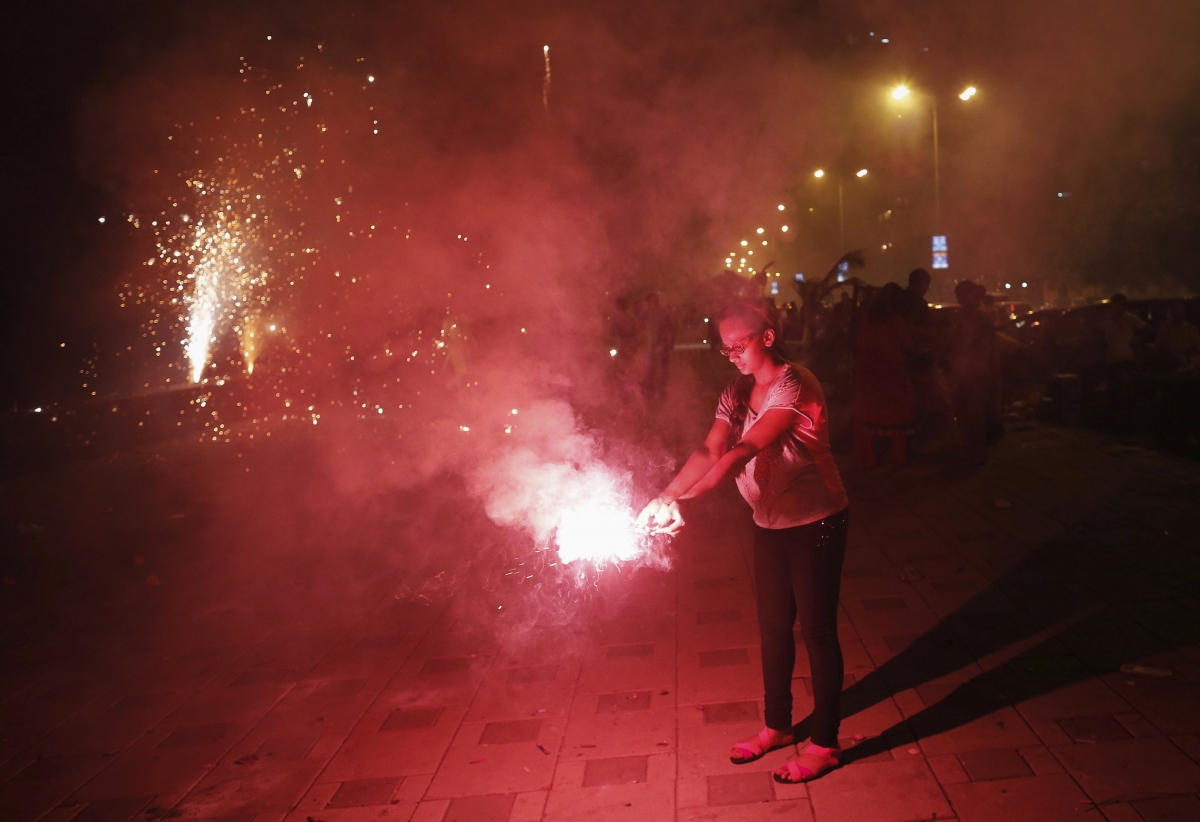 Children lights up crackers to celebrate the festival Diwali 2014