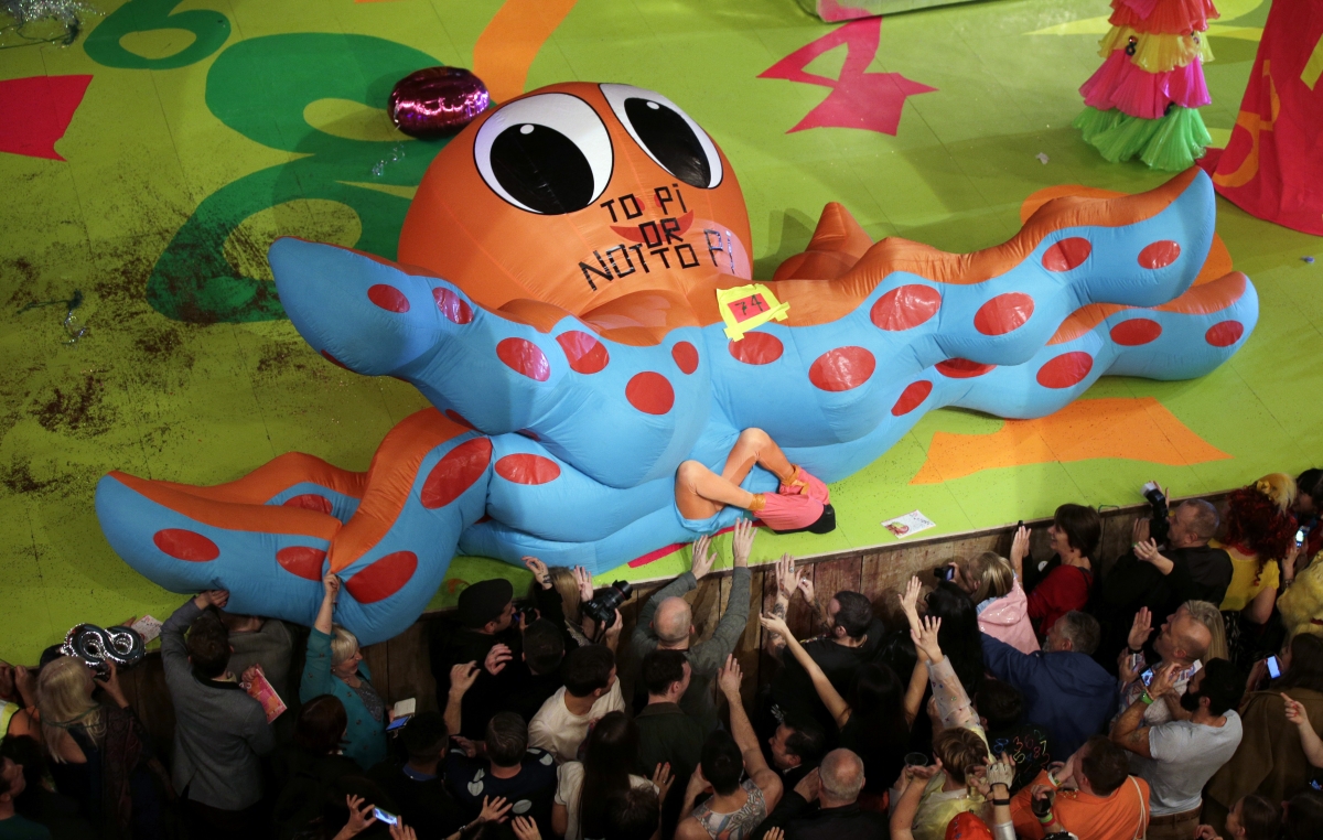 A contestant falls near the edge of the stage during the swimwear section of the Alternative Miss World contest A contestant falls near the edge of the stage during the swimwear section of the Alternative Miss World contest