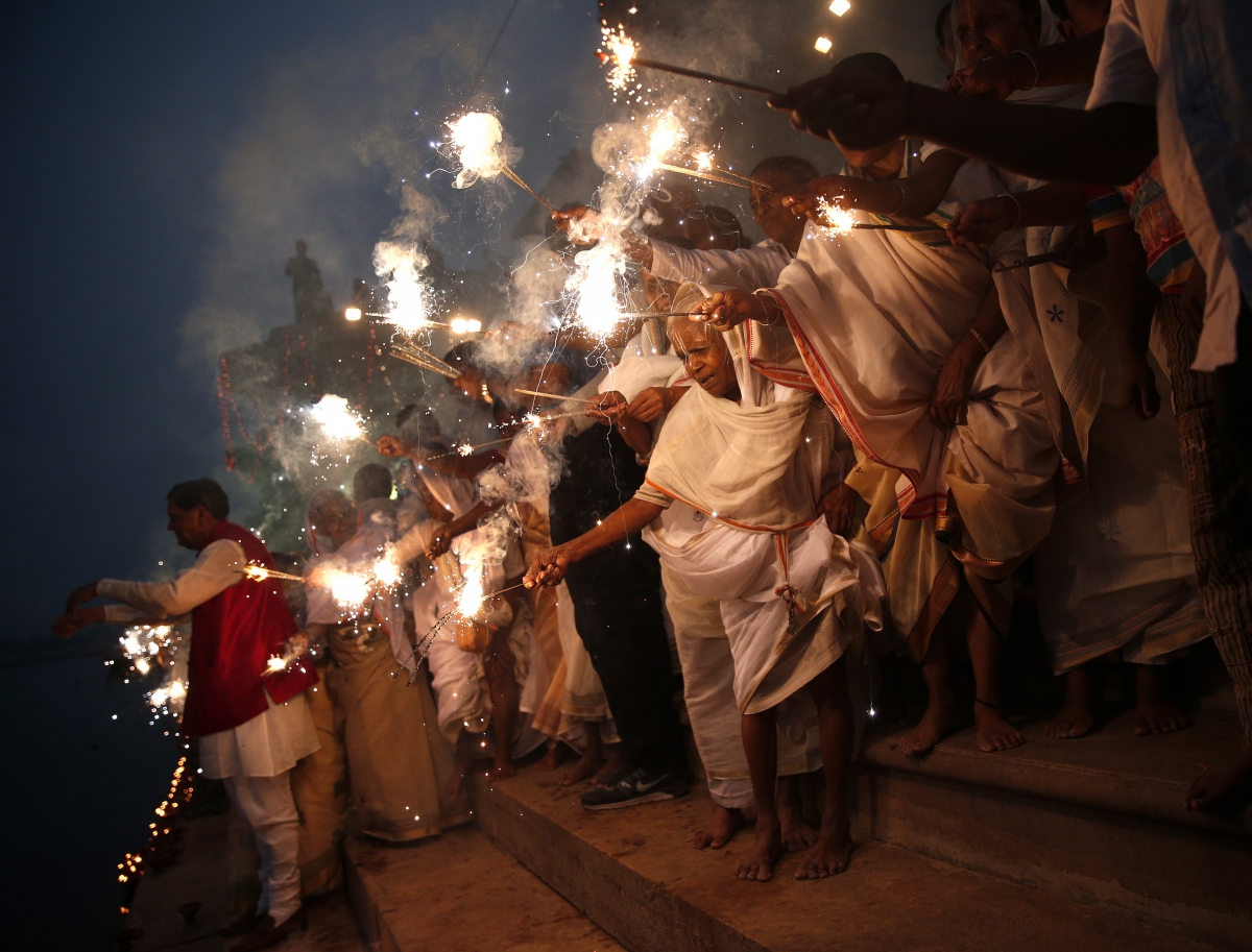 Widows, who have been abandoned by their families, light sparklers after offering prayers on the banks of the river Yamuna as part of Diwali celebrations organised by non-governmental organisation Sulabh International in Vrindavan