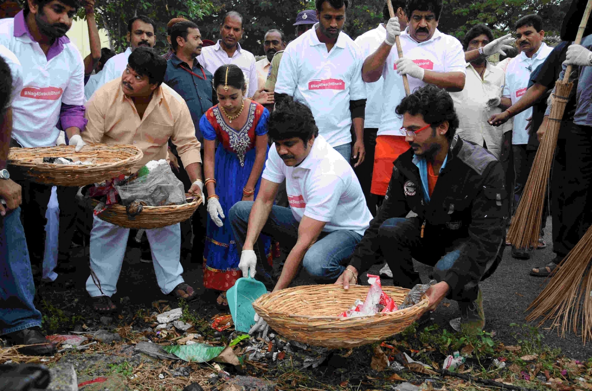 Nagarjuna Cleaning dirt as a part of Swachh Bharat campaign Nagarjuna, Naga Chaitanya and Akhil Vow To Sustain Swachh Bharat
