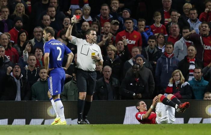 Referee Phil Dowd shows Chelsea's Branislav Ivanovic (L) the red card after his foul on Manchester United's Angel Di Maria (R) during their English Premier League match against Chelsea at Old Trafford Manchester United vs Chelsea