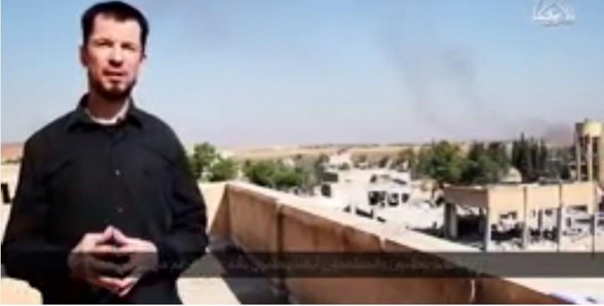 In its latest video, British journalist and ISIS prisoner reports from Kobani. The video claims that ISIS has taken over the town. Here Cantlie claims that from where he is standing he can see the Kurdish refugee camps. In its latest video, British journalist and ISIS prisoner reports from Kobani. The video claims that ISIS has taken over the town. Here Cantlie claims that from where he is standing he can see the Kurdish refugee camps.