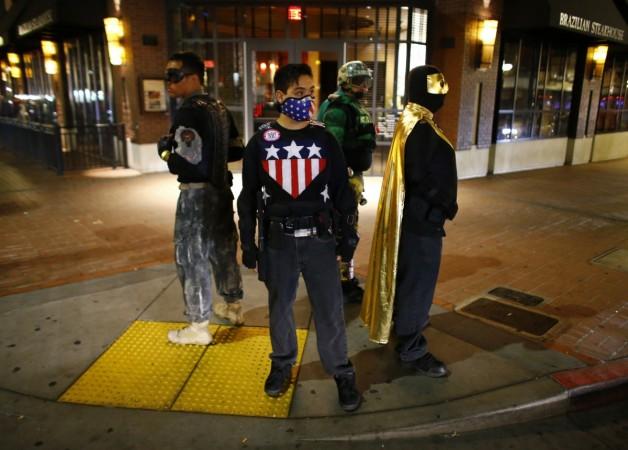 Fallen Boy, Freedom Fighter, Mr. Xtreme and Vortex of the Xtreme Justice League stand watch on a street corner during a patrol in downtown San Diego, California Xtreme Justice League, a band of real life superheroes fighting crime in San Diego