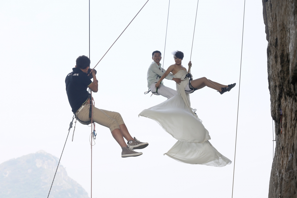Wedding photos taken during rock climbing