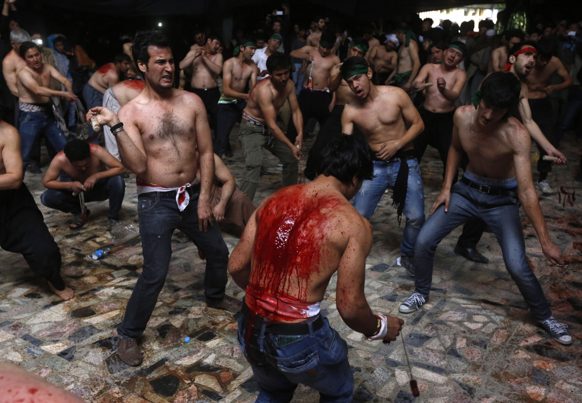 Photo: Afghan Shi'ite Muslim men flagellate themselves during a Muharram procession in Kabul October 31, 2014. Ashura 2014