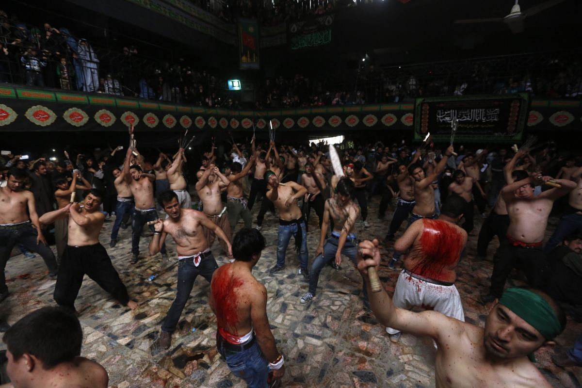 Picture: Afghan Shi'ite Muslim men flagellate themselves during a Muharram procession in Kabul October 2014. Afghan Shi'ite Muslim men flagellate themselves during a Muharram procession in Kabul October 31, 2014.