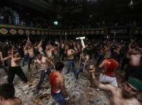 Afghan Shi'ite Muslim men flagellate themselves during a Muharram procession in Kabul October 31, 2014.