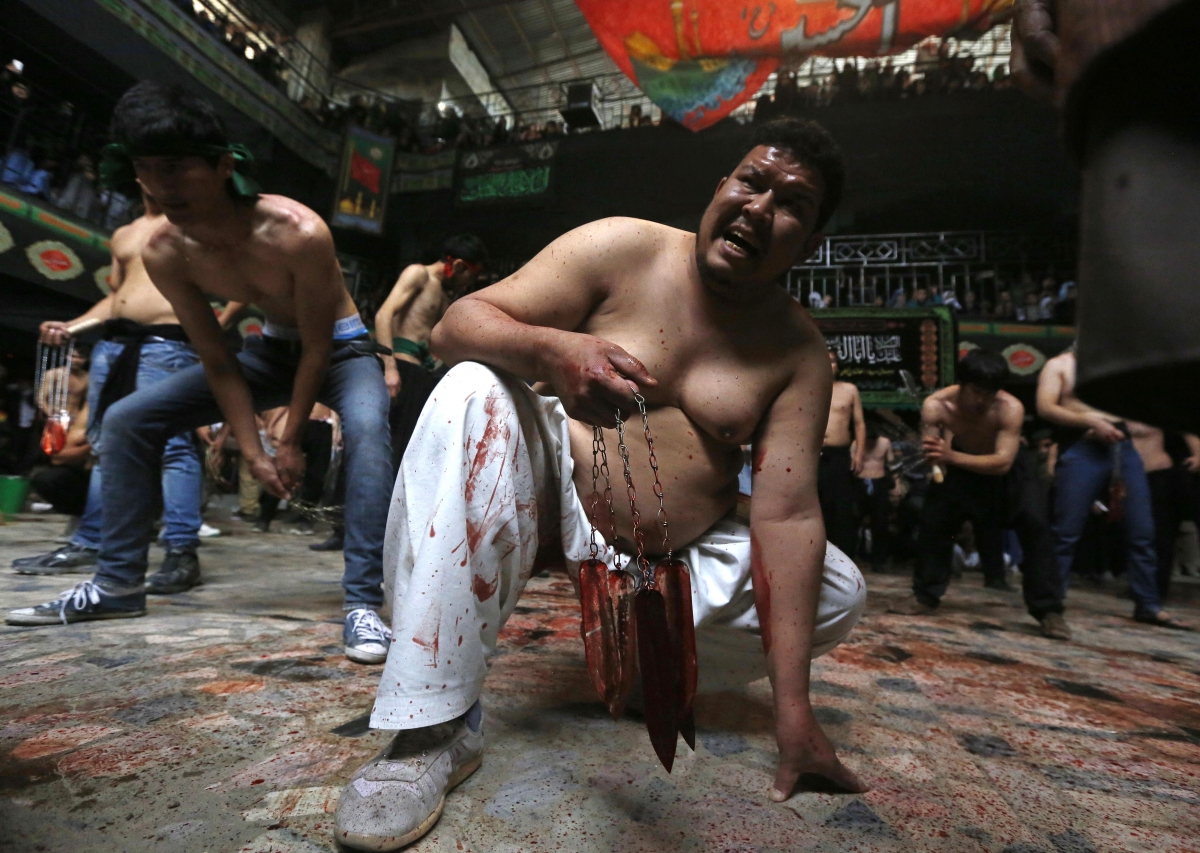 Photo: Afghan Shi'ite Muslim men flagellate themselves during a Muharram procession in Kabul October 31, 2014. Afghan Shi'ite Muslim men flagellate themselves during a Muharram procession in Kabul October 31, 2014.