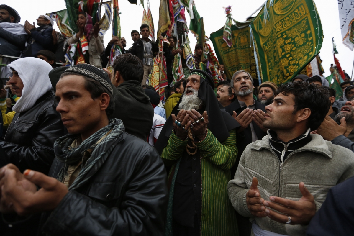 Afghans pray during a procession held to mark Ashura in Kabul
