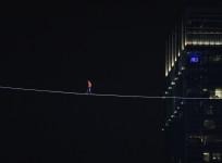 Daredevil Nik Wallenda walks along a tightrope between two skyscrapers