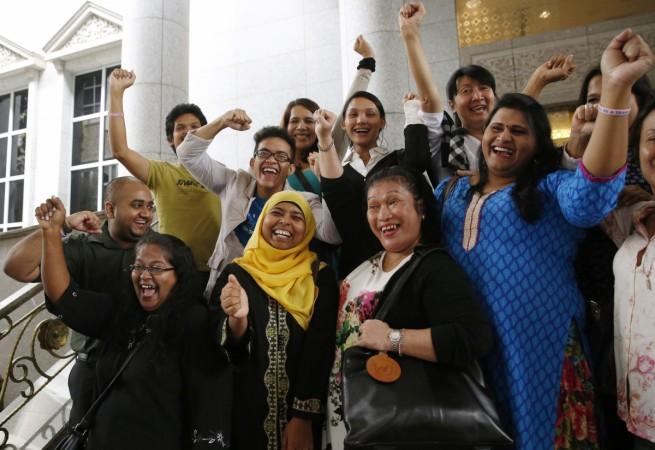 Activists celebrate overturning a sharia law against cross-dressing at the Appeals Court in the Palace of Justice in Putrajaya November 7, 2014. Activists celebrate overturning a sharia law against cross-dressing at the Appeals Court in the Palace of Justice in Putrajaya November 7, 2014.