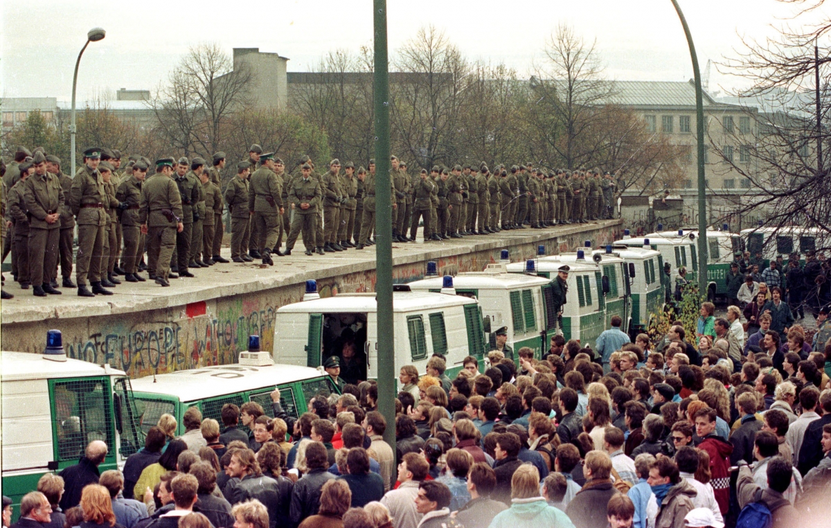 25th Anniversary of Berlin Wall's Fall: (Photo: Hundreds of East Berlin border guards stand atop the Berlin Wall at the Brandeburg Gate faced by thousands of West Berliners in this November 11, 1989 file photo.) 25th Anniversary of Berlin Wall's Fall: