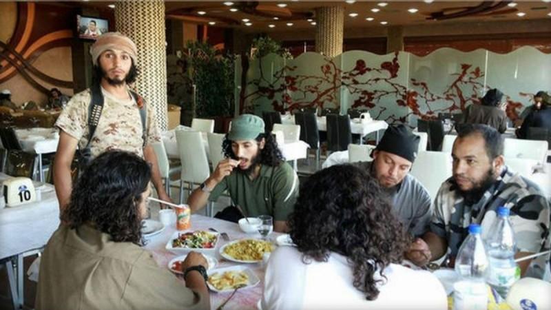 ISIS militants having food together in a posh hotel in Raqqa,Syria.