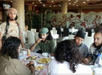 ISIS militants having food together in a posh hotel in Raqqa,Syria.
