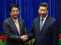 China's Xi and Japan's Abe 'Reconcilation Meet' Photo lands them on Top List of 'Awkward Handshakes'