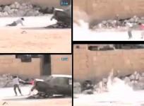 Dramatic video footage out of Syria show young boy braving fire to save his sister.