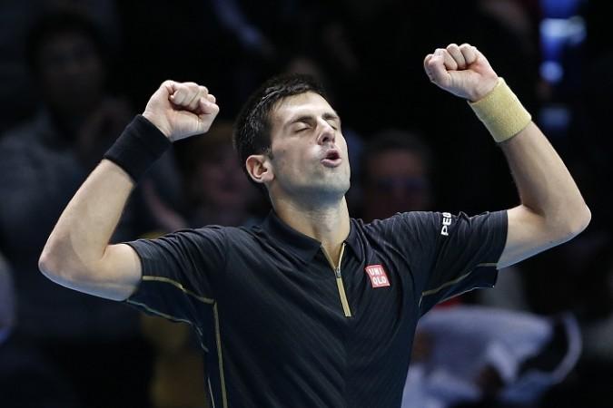 Novak Djokovic celebrates after defeating Stanislas Wawrinka in the ATP World Tour Finals Novak Djokovic ATP World Tour Finals