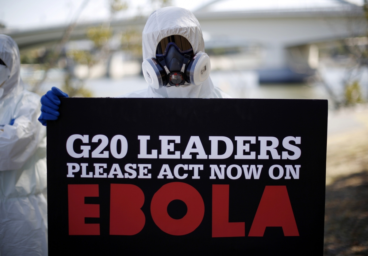 A protester dressed in protective equipment calls for G20 leaders to address the Ebola issue G20 Summit 2014
