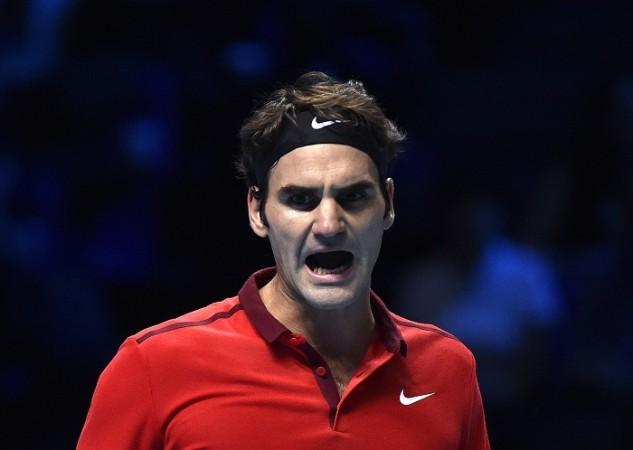 Roger Federer exults after winning a point in the ATP World Tour Finals semifinal battle against Stanislas Wawrinka Roger Federer ATP World Tour Finals