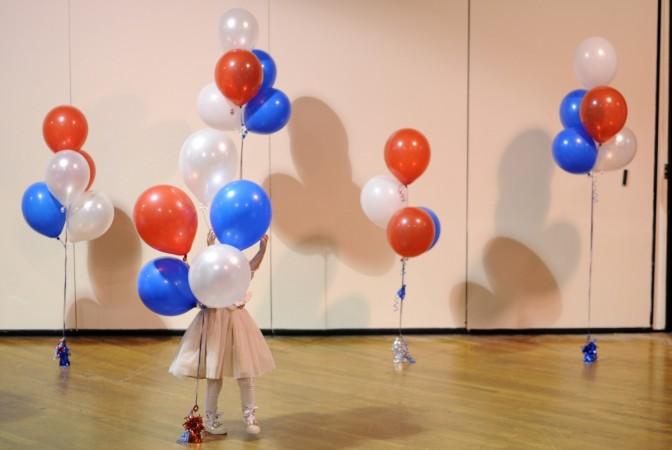 A boy dressed as Superman plays with a bubble machine at the Flint family's annual Halloween block party in Silver Spring, Maryland October 31, 2014