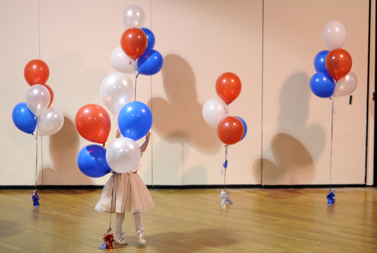 A boy dressed as Superman plays with a bubble machine at the Flint family's annual Halloween block party in Silver Spring, Maryland October 31, 2014 (Photo: A little girl plays with balloons at Republican U.S. Senate candidate Scott Brown's midterm election night rally in Manchester, New Hampshire November 4, 2014. ) A boy dressed as Superman plays with a bubble machine at the Flint family's annual Halloween block party in Silver Spring, Maryland October 31, 2014