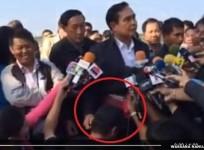 Thailand's new PM, General Prayuth Chan-Ocha is seen stroking the head of a journalist and gently tugging his right ear in camera.