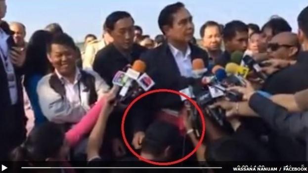 Thailand's new PM General Prayuth Chan-Ocha is seen stroking the head of a journalist and gently tugging at his right ear on camera. Thailand's new PM, General Prayuth Chan-Ocha is seen stroking the head of a journalist and gently tugging his right ear in camera.