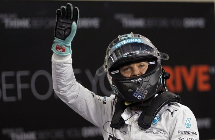 Mercedes driver Nico Rosberg celebrates after taking pole in the Abu Dhabi Grand Prix Nico Rosberg Mercedes